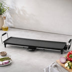 Vue de dessus de la plancha Taurus Maxi Giga Heat XL vide sur plan de travail blanc