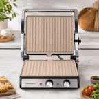 Gril Taurus Asteria Ceramic ouvert montrant les plaques Rockstone beige sur plan de travail blanc