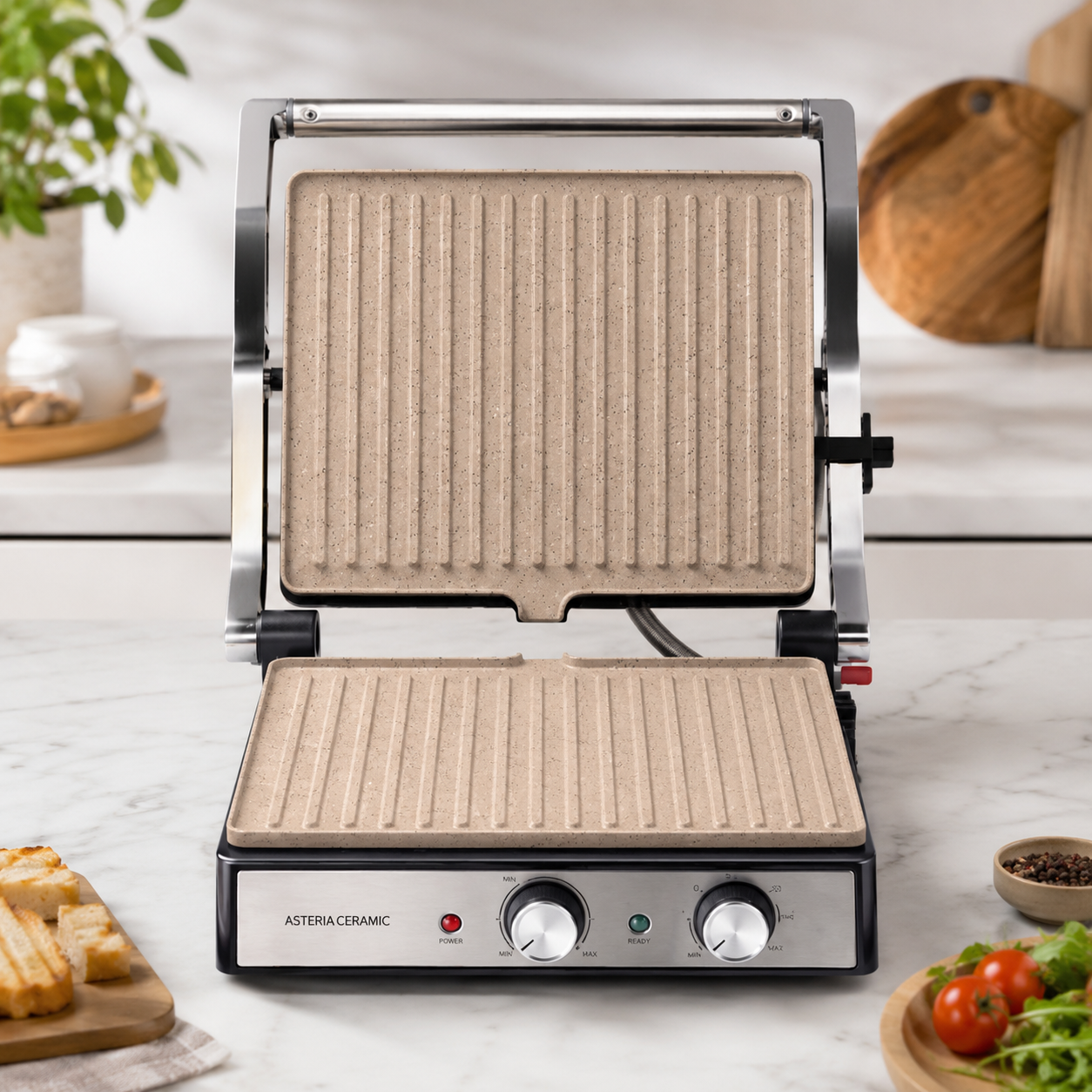 Gril Taurus Asteria Ceramic ouvert montrant les plaques Rockstone beige sur plan de travail blanc